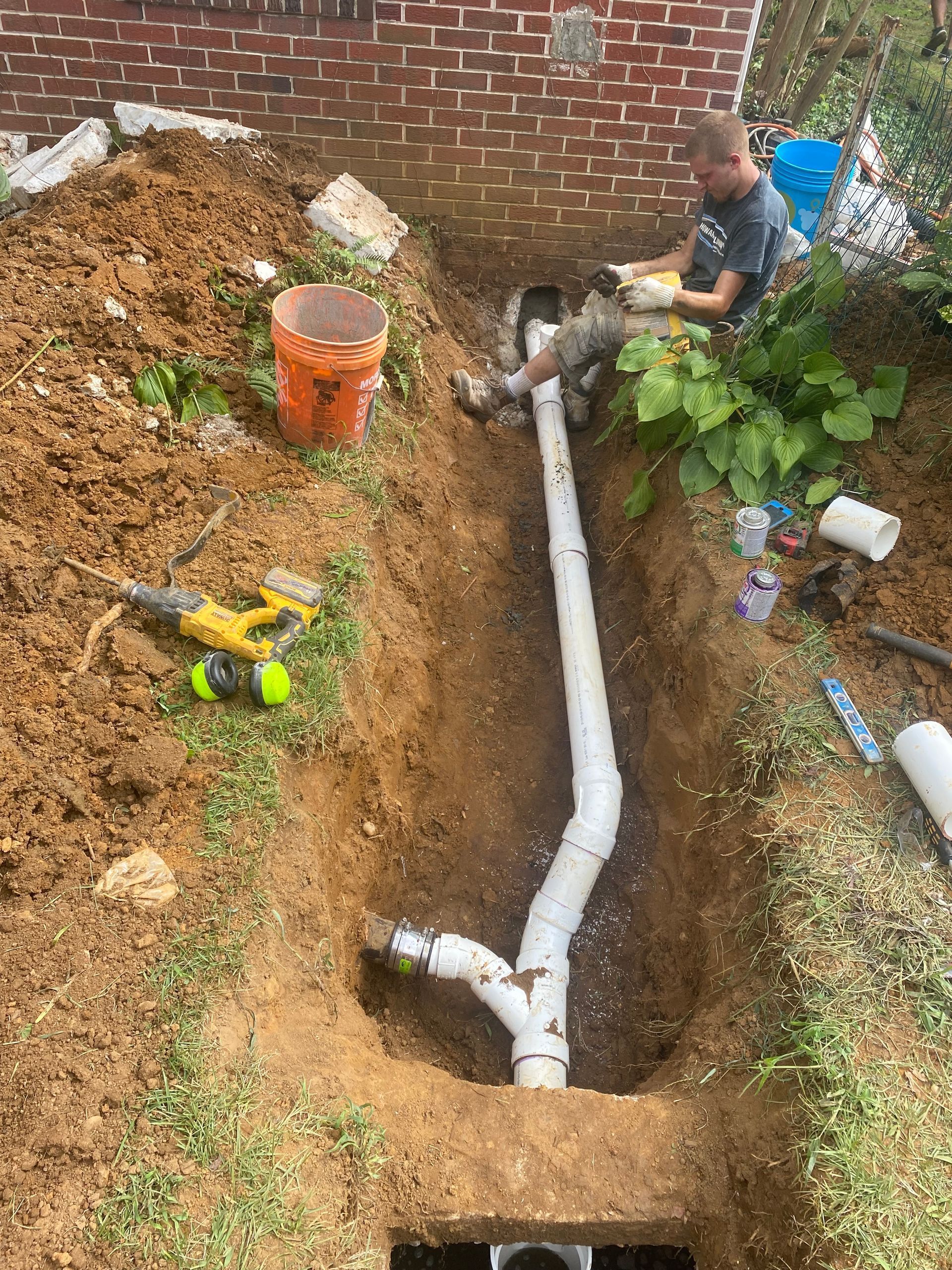 Howard Plumbing technician on a water heater replacement job in Annapolis, MD